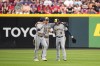 Milwaukee Brewers' Christian Yelich, left, Joey Wiemer (28) and Brian Anderson (9) celebrate following the team's baseball game against the Cincinnati Reds in Cincinnati, Friday, June 2, 2023. (AP Photo/Jeff Dean)