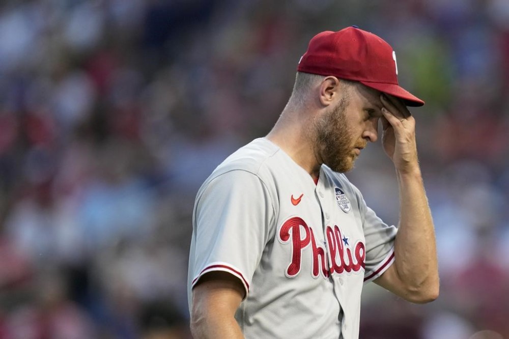 Philadelphia Phillies starting pitcher Zack Wheeler walks off the field at the end of the second inning of a baseball game against the Washington Nationals, Friday, June 2, 2023, in Washington. Washington scored four runs against Wheeler in the second. (AP Photo/Patrick Semansky)
