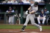 Colorado Rockies' Ryan McMahon hits a solo home run during the first inning of a baseball game against the Colorado Rockies Friday, June 2, 2023, in Kansas City, Mo. (AP Photo/Charlie Riedel)