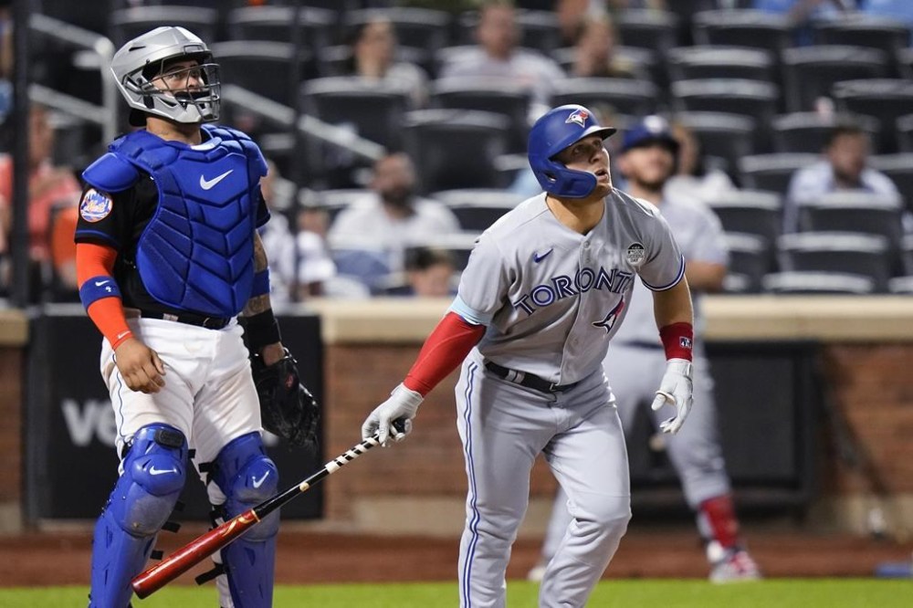 Toronto Blue Jays' Daulton Varsho watches his two-run home run next to New York Mets catcher Francisco Alvarez during the ninth inning of a baseball game Friday, June 2, 2023, in New York. (AP Photo/Frank Franklin II)