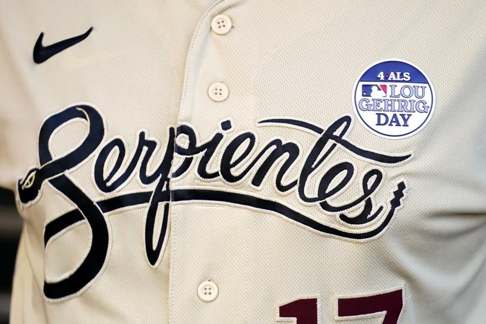 Arizona Diamondbacks manager Torey Lovullo sports a special MLB 4 ALS Lou Gehrig Day patch on a Serpientes jersey prior to a baseball game against the Atlanta Braves, Friday, June 2, 2023, in Phoenix. (AP Photo/Ross D. Franklin)