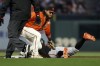 Baltimore Orioles' Jorge Mateo, right, is tagged out on a steal-attempt by San Francisco Giants shortstop Brandon Crawford during the fourth inning of a baseball game in San Francisco, Friday, June 2, 2023. (AP Photo/Jed Jacobsohn)