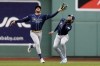 Tampa Bay Rays' Jose Siri makes the catch in front of Josh Lowe on a fly out by Boston Red Sox's Justin Turner during the first inning of the first baseball game of a doubleheader, Saturday, June 3, 2023, in Boston. (AP Photo/Michael Dwyer)