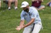 Jon Rahm, of Spain, reacts after missing a birdie putt on the 17th green during the third round of the Memorial golf tournament Saturday, June 3, 2023, in Dublin, Ohio. (AP Photo/Darron Cummings)