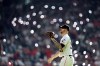 Houston Astros relief pitcher Ryan Pressly reaches for the ball as he takes the mound to pitch during the ninth inning of a baseball game against the Los Angeles Angels Saturday, June 3, 2023, in Houston. The Astros won 9-6. (AP Photo/David J. Phillip)