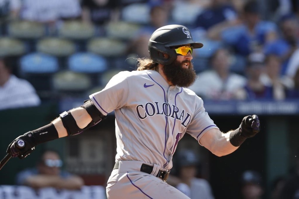 Colorado Rockies designated hitter Charlie Blackmon follows through on an RBI-single during the sixth inning of a baseball game against the Kansas City Royals in Kansas City, Mo., Saturday, June 3, 2023. (AP Photo/Colin E. Braley)