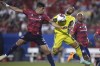 Nashville SC midfielder Hany Mukhtar (10) jumps to play the ball against FC Dallas defender José Antonio Martínez (3) during the second half of an MLS soccer match Saturday, June 3, 2023, in Frisco, Texas. (AP Photo/LM Otero)