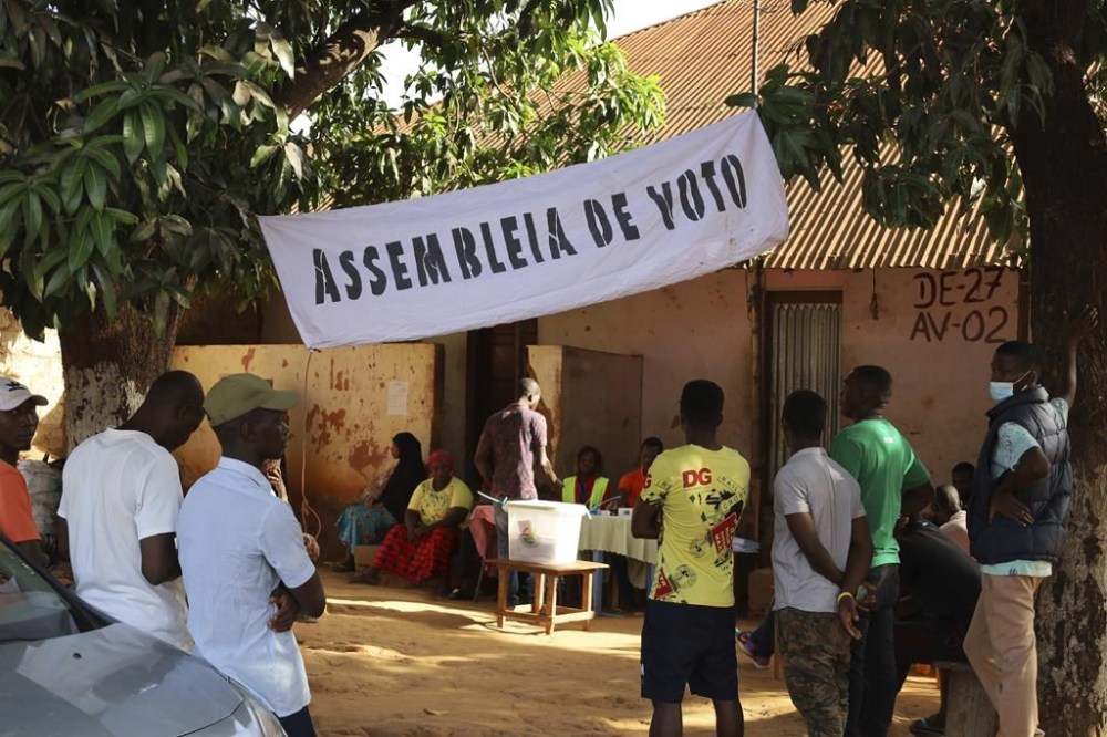 People line up to cast their ballots in Guinea-Bissau's legislative elections in Bissau Sunday June 4, 2023. The Centre for Democracy and Development, an African human rights organisation, said nearly 1 million voters were registered to elect more than 100 lawmakers from six parties with active seats in the National People's Assembly. (AP Photo/Darcicio Barbosa)