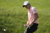 Collin Morikawa reacts to a missed putt on the 17th green during the first round of the Memorial golf tournament, Thursday, June 1, 2023, in Dublin, Ohio. (AP Photo/Darron Cummings)