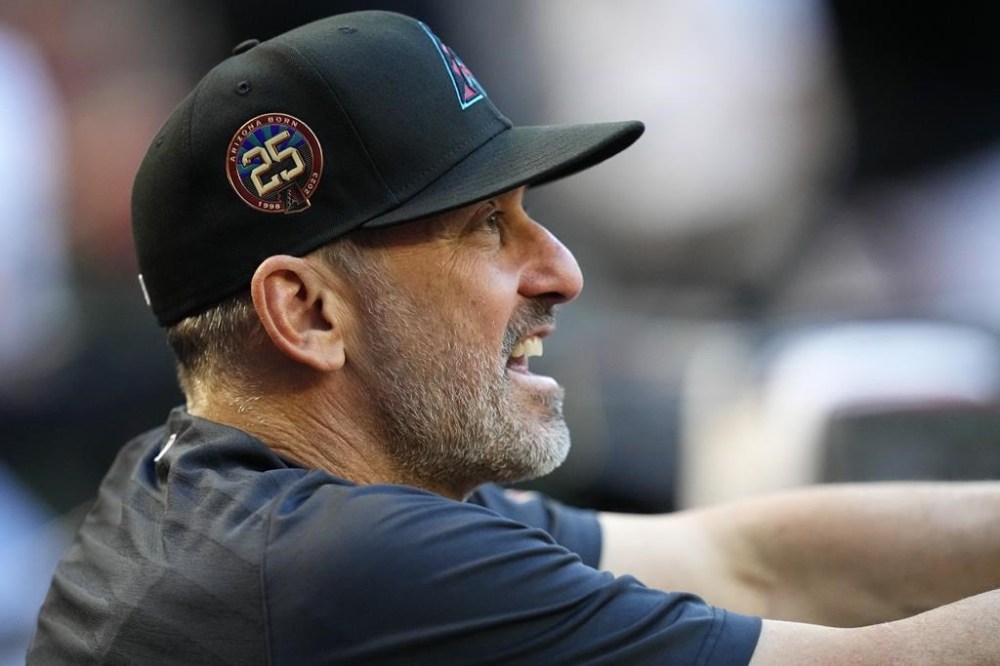 Arizona Diamondbacks manager Torey Lovullo watches play during the first inning of the team's baseball game against the Colorado Rockies on Tuesday, May 30, 2023, in Phoenix. The Diamondbacks won 5-1. (AP Photo/Ross D. Franklin)