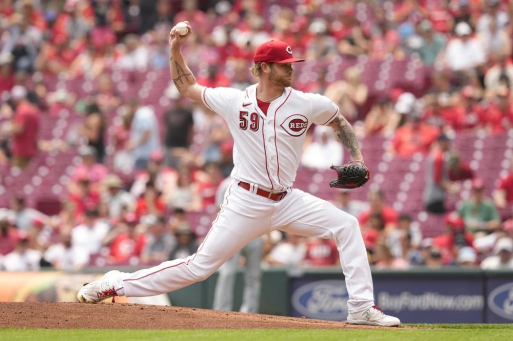 Cincinnati Reds starting pitcher Ben Lively throws against the Milwaukee Brewers in the first inning of a baseball game in Cincinnati, Sunday, June 4, 2023. (AP Photo/Jeff Dean)