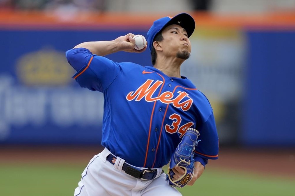 New York Mets starting pitcher Kodai Senga (34) throws in the first inning of a baseball game against the Toronto Blue Jays, Sunday, June 4, 2023, in New York. (AP Photo/John Minchillo)
