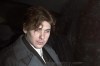 Paul Bernardo sits in the back of a police cruiser as he leaves a hearing in St. Catharines, Ont., April 5, 1994. The lawyer for the families of Paul Bernardo's victims says the killer and serial rapist should be returned to his maximum-security prison and transparency be provided around what led to his transfer to a medium-security facility in the first place.THE CANADIAN PRESS/Frank Gunn