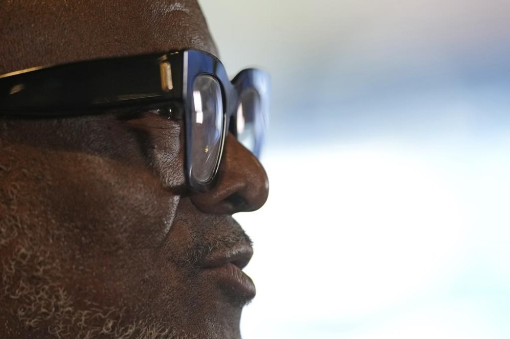 Former Chelsea soccer player Paul Canoville poses for a portrait during an interview with the Associated Press at Chelsea's Stamford Bridge ground in London, Thursday, March 2, 2023. Black players were only just beginning to integrate into some of England's biggest soccer teams in the 1980s when racism was rife and hooliganism was on the rise. British-born Paul Canoville tells The Associated Press how he was regularly called