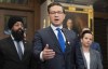 Flanked by Conservative Finance and Middle Class Prosperity critic Jasraj Singh Hallan and Conservative deputy leader Melissa Lantsman and other members of Parliament, Conservative leader Pierre Poilievre speaks with reporters in the Foyer of the House of Commons, Monday, June 5, 2023 in Ottawa. THE CANADIAN PRESS/Adrian Wyld