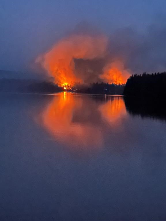 A wildfire burns near to Centennial Lake, near Matawatchan, Ont., on Sunday, June 4, 2023. The wildfire burning around Centennial Lake, about 150 kilometres west of Ottawa, was one of the 21 new fire starts in Ontario since Sunday, said fire adviser Shayne McCool, with the Ministry of Natural Resources and Forestry. THE CANADIAN PRESS/HO-Mike Coates, *MANDATORY CREDIT*