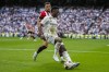 Real Madrid's Vinicius Junior, foreground, duels for the ball with Athletic Bilbao's Aitor Paredes during the Spanish La Liga soccer match at the Santiago Bernabeu stadium in Madrid, Sunday, June 4, 2023. (AP Photo/Bernat Armangue)