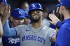 Kansas City Royals' MJ Melendez celebrates with teammates after scoring on a single by Salvador Perez during the first inning of a baseball game against the Miami Marlins, Monday, June 5, 2023, in Miami. (AP Photo/Wilfredo Lee)