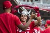Cincinnati Reds' Stuart Fairchild celebrates in the dugout after hitting a solo home run during the third inning of a baseball game against the Milwaukee Brewers in Cincinnati, Monday, June 5, 2023. (AP Photo/Aaron Doster)