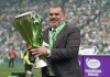 Celtic manager Angelos Postecoglou celebrates with the league trophy after winning the Scottish Premiership, at Celtic Park, Glasgow, Scotland, Saturday, May 27, 2023. (Andrew Milligan/PA via AP)