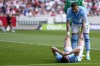 Manchester City's Aymeric Laporte helped by team mate Kyle Walker after an injury during the English Premier League soccer match between Brentford and Manchester City at the Gtech Community Stadium in London, Sunday, May 28, 2023. (AP Photo/Kirsty Wigglesworth)