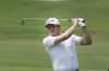 Mackenzie Hughes watches his approach shot on the ninth hole during the second round of the Byron Nelson golf tournament in McKinney, Texas, Friday, May 12, 2023. (AP Photo/LM Otero)