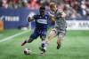 Vancouver Whitecaps' Javain Brown, left, tries to move the ball past CF Montreal's Robert Thorkelsson during the second half of an MLS soccer game in Vancouver, on Saturday, April 1, 2023. The Vancouver Whitecaps say they cannot underestimate CF Montreal, their Canadian Championship opponents, heading in to Wednesday night's cup final match. THE CANADIAN PRESS/Darryl Dyck