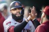 Arizona Diamondbacks' Emmanuel Rivera is congratulated after scoring during the fifth inning of the team's baseball game against the Washington Nationals at Nationals Park, Tuesday, June 6, 2023, in Washington. (AP Photo/Alex Brandon)