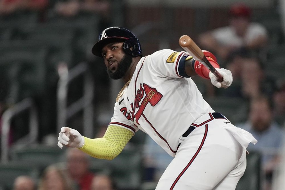 Atlanta Braves' Marcell Ozuna watches his RBI double in the sixth inning of the team's baseball game against the New York Mets on Tuesday, June 6, 2023, in Atlanta. (AP Photo/John Bazemore)