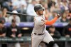 San Francisco Giants' Thairo Estrada follows the flight of his RBI-single off Colorado Rockies starting pitcher Dinelson Lamet in the second inning of a baseball game Tuesday, June 6, 2023, in Denver. (AP Photo/David Zalubowski)