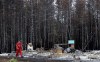 A firefighter walks past a home destroyed by a wildfire in Hammond's Plains, N.S., during a media tour, Tuesday, June 6, 2023. Rebuilding hundreds of homes destroyed by Nova Scotia's wildfires could take years. THE CANADIAN PRESS/POOL, Tim Krochak