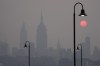 The sun rises over a hazy New York City skyline as seen from Jersey City, N.J., Wednesday, June 7, 2023. Intense Canadian wildfires are blanketing the northeastern U.S. in a dystopian haze, turning the air acrid, the sky yellowish gray and prompting warnings for vulnerable populations to stay inside. THE CANADIAN PRESS/AP-Seth Wenig