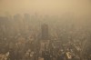 An aerial view shows New York City in a haze-filled sky from the Empire State Building observatory, Wednesday, June. 7, 2023, in New York. Smoke from Canadian wildfires poured into the U.S. East Coast and Midwest on Wednesday, covering cities of both nations in an unhealthy haze, holding up flights at major airports and prompting people to fish out pandemic-era face masks. (AP Photo/Yuki Iwamura)