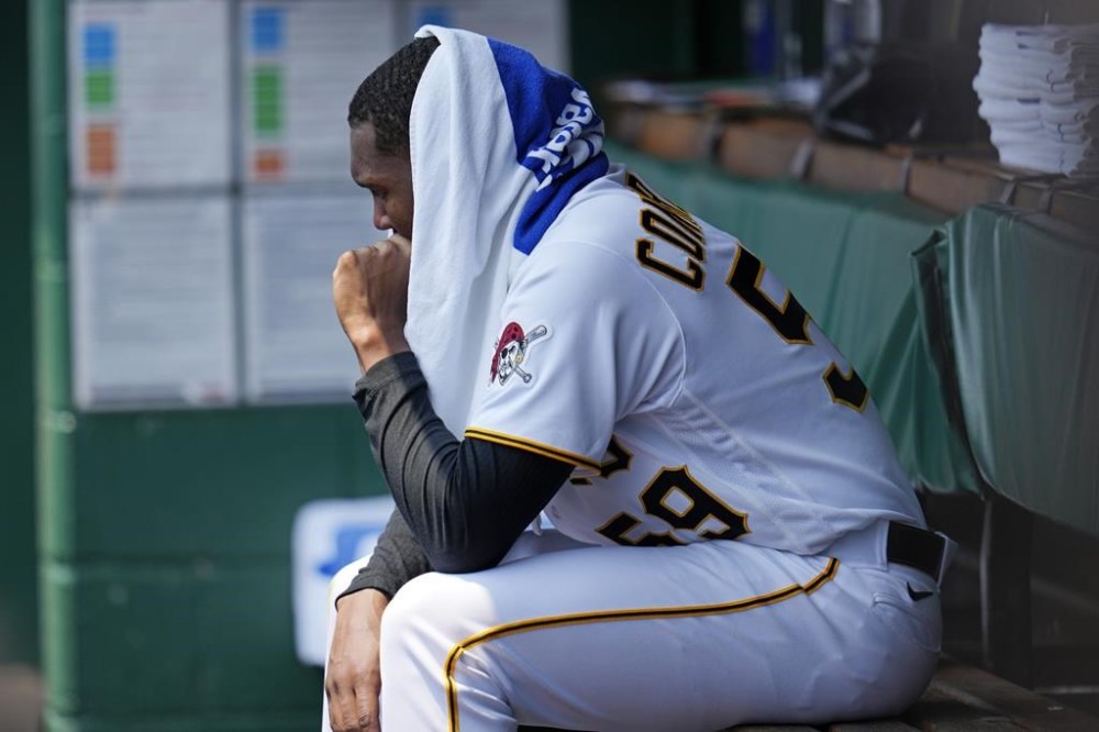 Pittsburgh Pirates starting pitcher Roansy Contreras sits in the dugout after being pulled from the team's baseball game against the Oakland Athletics during the first inning in Pittsburgh, Wednesday, June 7, 2023. (AP Photo/Gene J. Puskar)