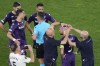 Fiorentina's Cristiano Biraghi bleeds after being hit by an object thrown from the stands during the Europa Conference League final soccer match between Fiorentina and West Ham at the Eden Arena in Prague, Wednesday, June 7, 2023. (AP Photo/Darko Vojinovic)