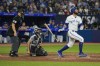 Toronto Blue Jays designated hitter Brandon Belt (13) hits a solo home run against the Houston Astros in sixth inning American League MLB baseball action in Toronto on Wednesday, June 7, 2023. THE CANADIAN PRESS/Andrew Lahodynskyj