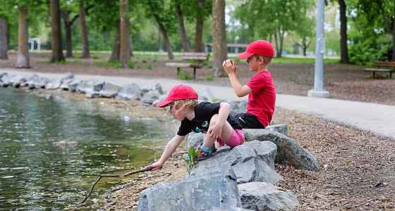 RUTH BONNEVILLE / WINNIPEG FREE PRESS Charlie Madden, 5, takes pictures of ducks while spending time with mom and his little sister, three-year-old Emily, at the duck pond at St. Vital Park Monday afternoon.  His mom says he's developed a real passion for taking photos of ducks and flowers when out at the park and random items, like his soccer ball, when playing out in their yard.