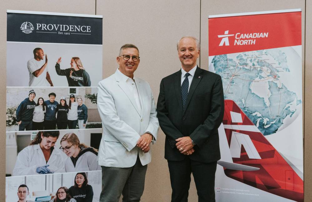 SUPPLIED
Providence University College’s president Kenton Anderson, left, and Canadian North’s CEO Michael Rodyniuk signed a letter of intent to move forward with an Inuit pilot training program Thursday.