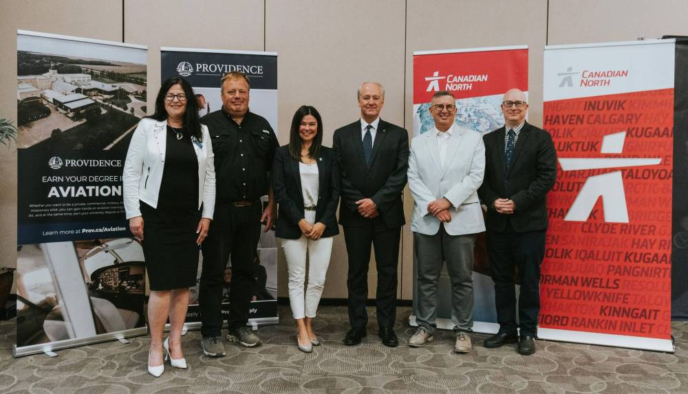 SUPPLIED
Graduates of a new degree program at the Otterburne-based school will automatically be offered a job with Canadian North, an airline that services northern Canada. From left: Anna Mondor, Providence’s vice-president of external relations; Adam Penner, owner of Harv’s Air Pilot Training; Shelly De Caria, Canadian North’s associate vice-president of sales and community investment; Michael Rodyniuk, Canadian North’s CEO, Kenton Anderson, Providence’s president; and Nicholas Greco, Providence’s provost.