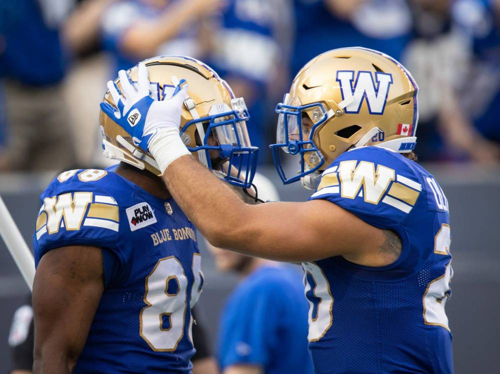 JESSICA LEE / WINNIPEG FREE PRESS
Blue Bombers Rasheed Bailey (88) and Brady Oliveira (20) during the game against the Tiger-Cats, Friday.