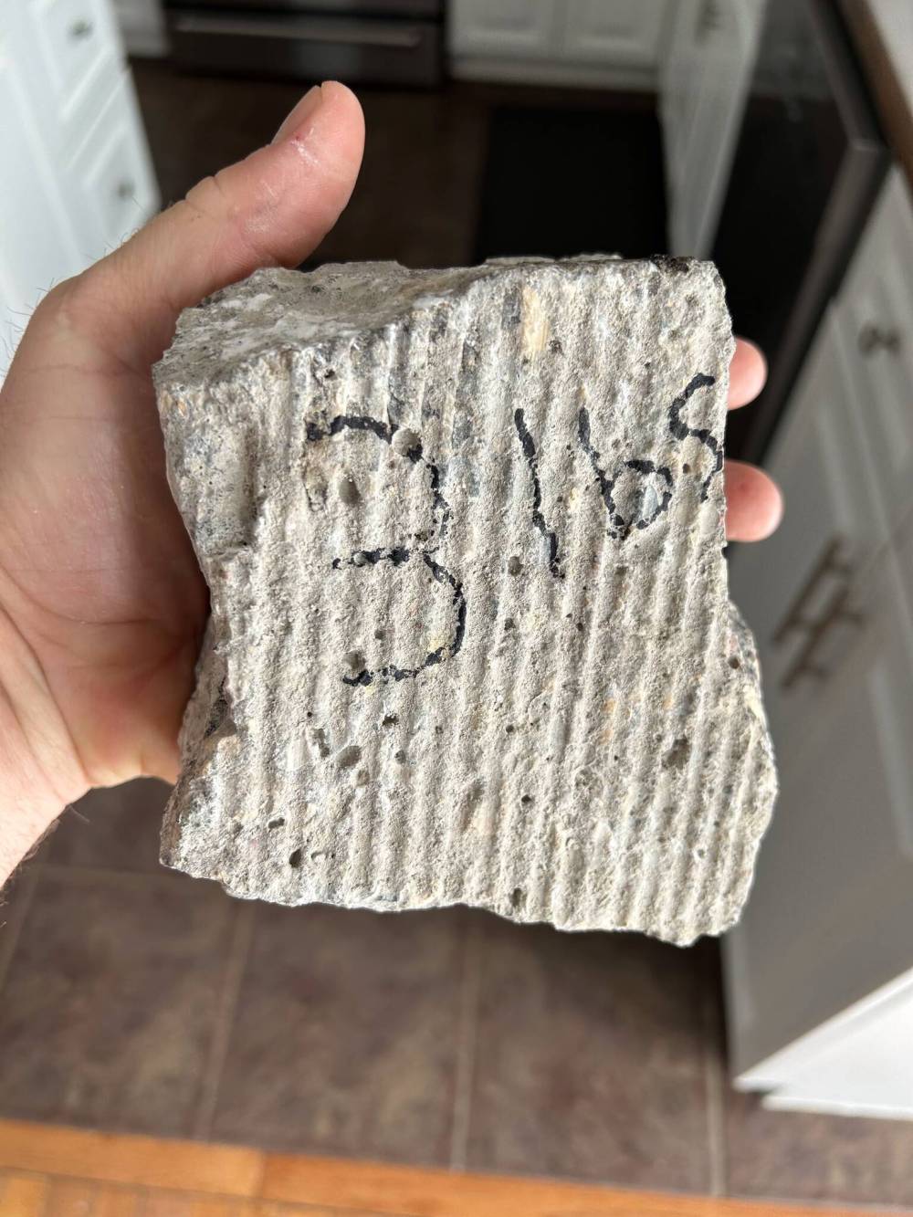SUPPLIEDThe chunk of concrete that was propelled through Eddie Friesen’s windshield.