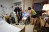 RUTH BONNEVILLE / WINNIPEG FREE PRESS 
                                Lucy Grey, centre, speaks with her husband Bernie Gray and their daughter Dianne Grey-Wysocki, in Lucy’s room at Golden Lakes Lodge where there is no air conditioning.