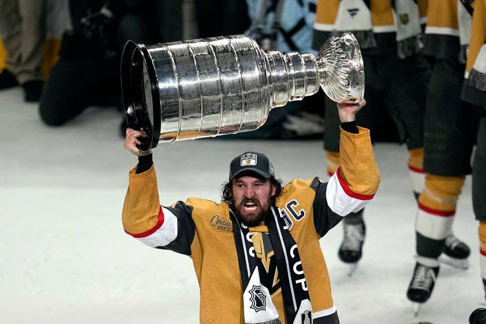 Abbie Parr / The Associated Press
Vegas Golden Knights captain Mark Stone celebrates with the Stanley Cup after the Knights defeated the Florida Panthers 9-3 in Game 5 of the Stanley Cup Final, Tuesday.