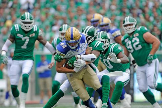 Winnipeg Blue Bombers wide receiver Drew Wolitarsky is tackled by the Saskatchewan Roughriders during CFL football action at Mosaic Stadium in Regina in 2018. (Mark Taylor / The Canadian Press files)