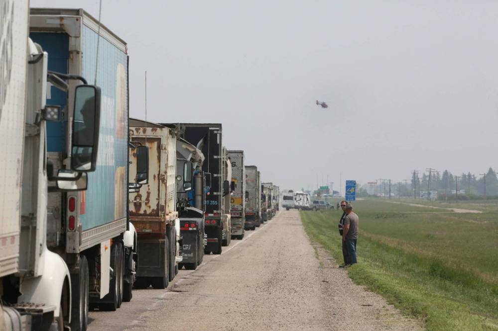 MATT GOERZEN / THE BRANDON SUN
A STARS Air Ambulance helicopter flies out from behind a line of vehicles along the eastbound lanes of the Trans-Canada Highway after the highway lanes were shut down on Thursday afternoon, due to a severe collision at the Highway 5 intersection.