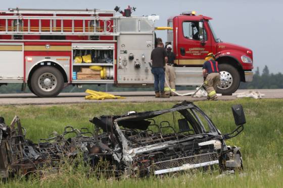 A small burned-out transport bus lies in the ditch on the south side of the Trans-Canada Highway at the intersection with Highway 5 near Carberry on Thursday afternoon. (Matt Goertzen / The Brandon Sun files)
