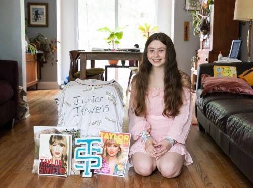 Scarlett Lloyd chose to wear an outfit from Taylor Swift&rsquo;s Lover Era to the concert in Minneapolis. On her luggage is a T-shirt she made for her mom Erin, which is similar to a shirt Swift wore in her You Belong with Me music video. (Jessica Lee / Winnipeg Free Press)
