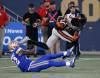 John Woods / THE CANADIAN PRESS
                                B.C. Lions’ Alexander Hollins avoids a tackle by Winnipeg Blue Bombers Desmond Lawrence Thursday night at IG field.