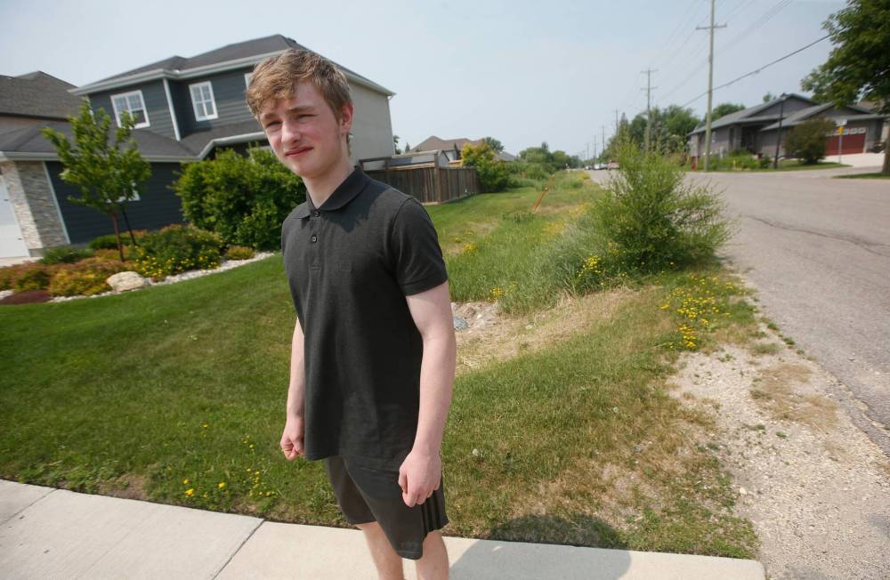 Logan Funk, who saved a young boy from a coyote attack, near the place where the boy was mauled on Knowles Avenue. (John Woods / Winnipeg Free Press)