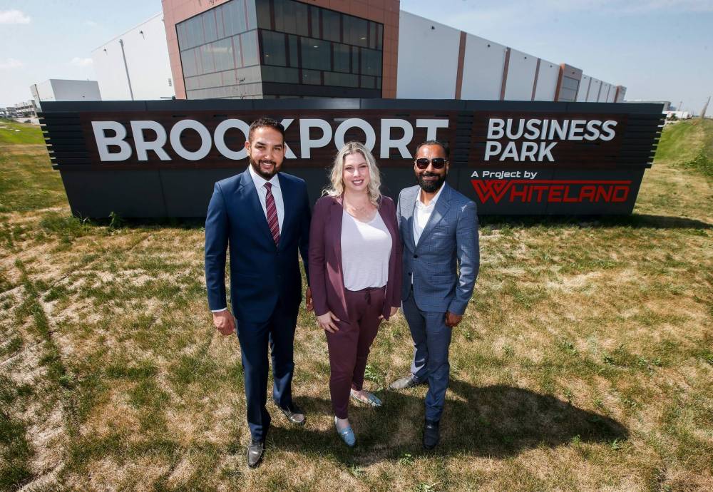 JOHN WOODS / WINNIPEG FREE PRESS
Satpal Sidhu, president of Whiteland Developers, Carly Edmundson, CEO of CentrePort and Amrit Jhand, CEO of Whiteland Developers, outside one of their projects at CentrePort in Winnipeg.